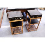 A good pair of Chinese black lacquer and bamboo two tier single drawer lamp tables