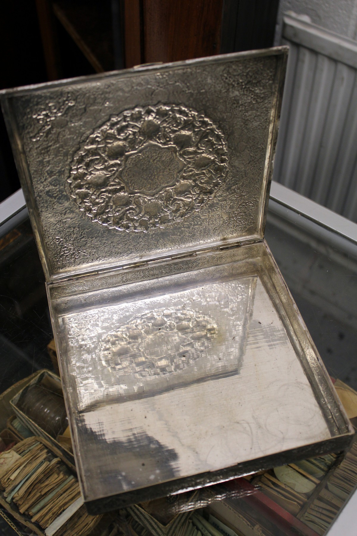 A good Eastern silver square shaped box with hinged cover having ornate embossed decoration - Image 2 of 3