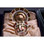 A miniature Crown Derby Imari cup and saucer, boxed