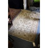 A good Persian rug beige ground with stylised floral decoration