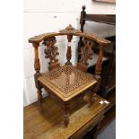 An unusual 19th century carved walnut childs corner armchair