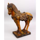 A CHINESE SANCAI POTTERY MODEL OF A STRIDING HORSE, 42cm high x 35cm,