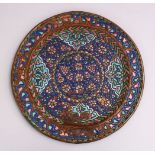 A GOOD 19TH CENTURY SYRIAN ENAMEL CIRCULAR METAL DISH, with raised enamel decoration, 25cm