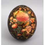 A GOOD 19TH CENTURY PERSIAN PAINTED OSTRICH EGG, decorate with scenes of floral display, 16cm.
