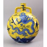 A GOOD CHINESE FAMILLE JAUNE BLUE & WHITE PORCELAIN DRAGON MOON FLASK, the yellow ground bearing