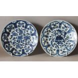 A PAIR OF CHINESE KANGXI PERIOD BLUE & WHITE SHIPWRECK PORCELAIN PLATES, approx 21cm diameter each.