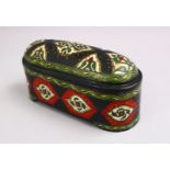 AN ISLAMIC ENAMEL COPPER LIDDED BOX, decorated with formal foliage decoration, 21cm wide.