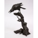 A GOOD JAPANESE MIJI PERIOD BRONZE OKIMONO OF A BIRD, seated upon a stylized wooded outcrop, the