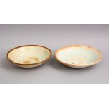 A GOOD PAIR OF EARLY CHINESE POTTERY BOWLS, 14cm & 15cm diameter