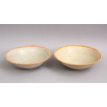 A GOOD PAIR OF EARLY CHINESE POTTERY BOWLS, 15cm diameter.