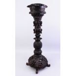 A GOOD 19TH CENTURY INDIAN CARVED WOOD PLANT STAND / JARDINIERE, well carved in deep relief to