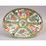 A 19TH CENTURY CHINESE CANTON FAMILLE ROSE PORCELAIN DISH, with panel decoration of figures exterior