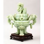 A GOOD CHINESE CARVED JADE TRIPOD CENSER, COVER & STAND, the censer carved with twin lion dog