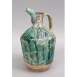 A 12TH / 13TH CENTURY PERSIAN KASHAN TURQUOISE POTTERY EWER, 25cm high.