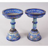 A PAIR OF 19TH CENTURY CHINESE CANTON ENAMEL CANDLE STICKS / STANDS, the stands decorated with