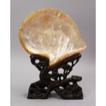 A GOOD 19TH CENTURY CHINESE CARVED MOTHER OF PEARL SHELL ON STAND, the shell carved in canton