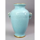 A GOOD CHINESE CELADON MOULDED TWIN HANDLE VASE, the bodyw ith carved archaic style decoration