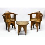 A 19TH CENTURY MOORISH INLAID WOODEN PAIR OF ARM CHAIRS AND TABLE, inlaid with a multitude of