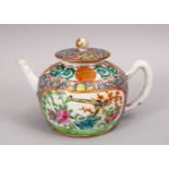 A 19TH CENTURY CHINESE FAMILLE ROSE PORCELAIN TEA POT, with panel decoration of native floral