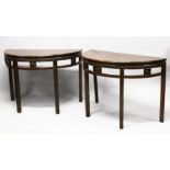 A FINE PAIR OF 18TH / 19TH CENTURY CHINESE CARVED HARDWOOD DEMI LUNE TABLES, the tops with a