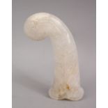 A GOOD INDIAN MUGHAL / ISLAMIC CARVED JADE / CRYSTAL DAGGER HANDLE, with carved formal motif, 13cm.