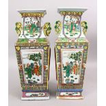 A PAIR OF 19TH CENTURY CHINESE CANTON FAMILLE ROSE PORCELAIN VASES, the body of the vases with