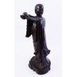 A LARGE CHINESE CARVED HARD WOOD POSSIBLY ZITAN CARVED FIGURE OF LUOHAN, the dense well carved