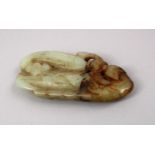 A CHINESE CARVED JADE PENDANT OF A CHILONG AND FRUIT, 8cm.