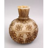 A HEAVY INDIAN MUGHAL CARVED JADE FLORAL VASE, the body of the vase with floral carved decoration,