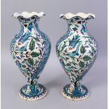 A PAIR OF 19TH CENTURY TURKISH OTTOMAN KUTAHIYA BALUSTER SHAPE VASES, painted in the Iznik style,