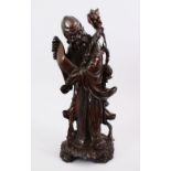 A LARGE 19TH / 20TH CENTURY HARDWOOD FIGURE OF SHOU LAO, with bone inlaid eyes holding his staff,