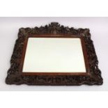 A FINE 19TH CENTURY CHINESE CANTON CARVED WOOD MIRROR, the frame of the mirror decorated with