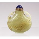 A GOOD CHINESE CARVED JADE SNUFF BOTTLE, carved with lotus decoration and twin handles, with lapiz