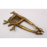 A 17TH / 18TH CENTURY SOUTH INDIAN BRONZE BETEL NUT CUTTER, 17cm.