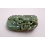 A CHINESE CARVED JADE PEBBLE OF A DRAGON, 8CM.