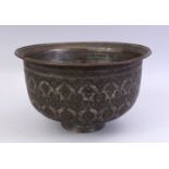 A GOOD SAFAVID BRONZE BOWL, carved with floral motif decoration, 26cm high.