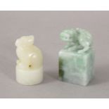 TWO 19TH / 20TH CENTURY CHINESE CARVED JADE / JADEITE SEALS, one white jade depicting a kylin, the