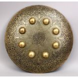 A 20TH CENTURY INDIAN CARVED BRASS CALLIGRAPHIC SHIELD, 40CM.