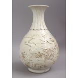 A CHINESE MING STYLE YUHUCHU PIN CARVED PORCELAIN VASE, carved wih birds amongst native flora and