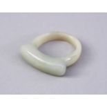 A CHINESE CARVED JADE STIRRUP RING, 2.5cm