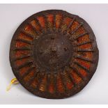 A GOOD 17TH CENTURY TURKISH OTTOMAN STEEL AND WOVEN SHIELD, 28cm.