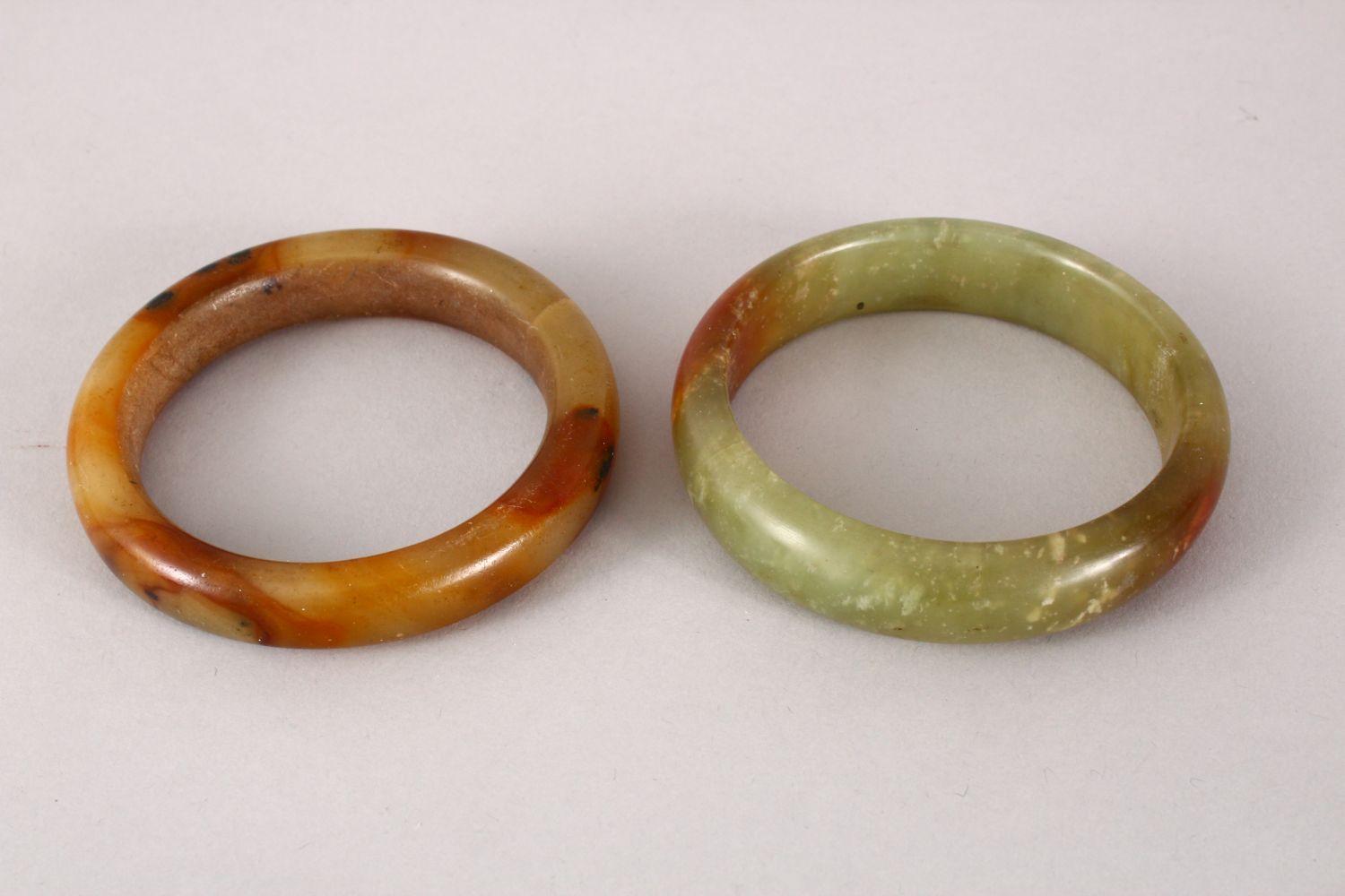 TWO 19TH / 20TH CENTURY CHINESE CARVED JADE BANGLES, both 8.5cm & internal 6cm & 6.5cm - Image 2 of 2