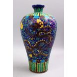A CHINESE MING STYLE SANCAI STYLE DECORATED PORCELAIN MEIPING VASE, the body with carved
