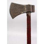 A FINE 18TH / 19TH CENTURY INDO PERSIAN ENGRAVED TABARZIN AXE, handle terminal has a concealed