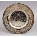 A PERSIAN ENGRAVED WHITE METAL OPENWORK DISH, 19CM.