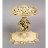 A 19TH CENTURY CHINESE CANTON CARVED IVORY PUZZLE BALL STAND, 9CM.