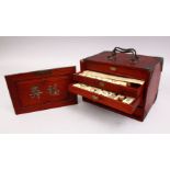 A GOOD CHINESE WOODEN BOXED MAHJONG GAMES SET, with carved symbols to the front and with 5 drawers