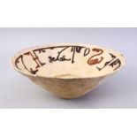 A GOOD EARLY ISLAMIC POTTERY BOWL, with painted decoration interior, AF, 29cm diameter.