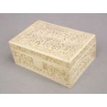 A GOOD 19TH CENTURY CHINESE CANTON CARVED IVORY LIDDED BOX, carved in relief to depict figures aside