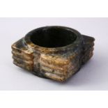 A GOOD CHINESE CARVED JADE CONG SECTION, with a ribbed body and cylindrical centre, 8.5cm square.